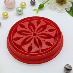 Floral Elegance in Crimson: Artistic Carving on a Disc